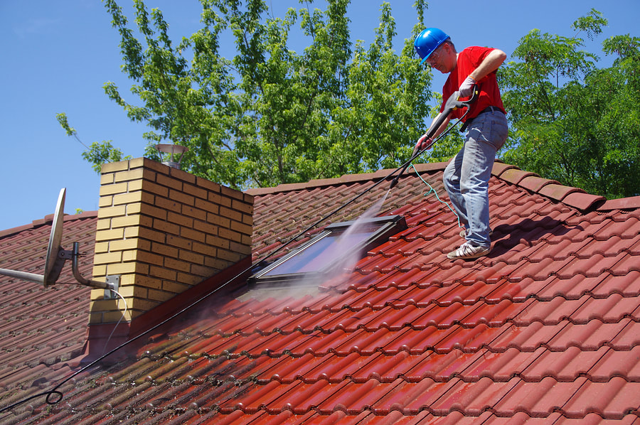 man cleaning the roof
